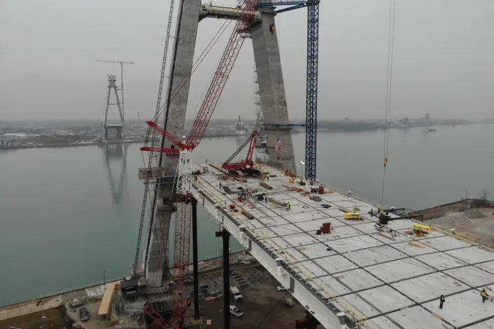 a crane next to a body of water