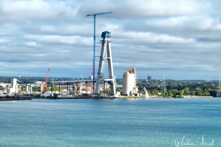 a large body of water with a city in the background