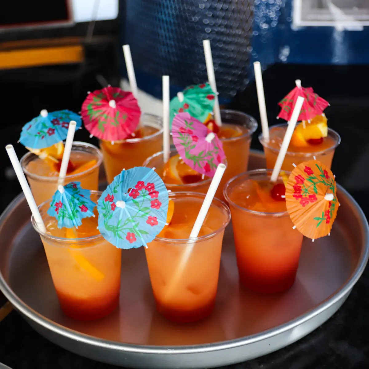 a bowl of orange cocktails on a table
