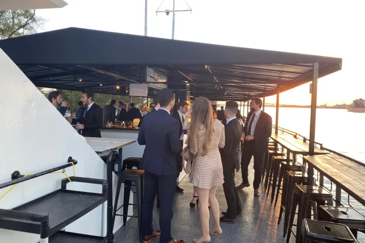 a group of people standing on a dock