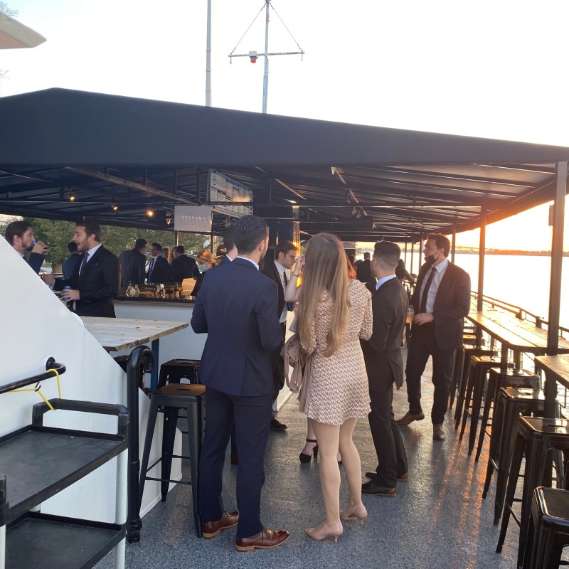 a group of people standing on a dock