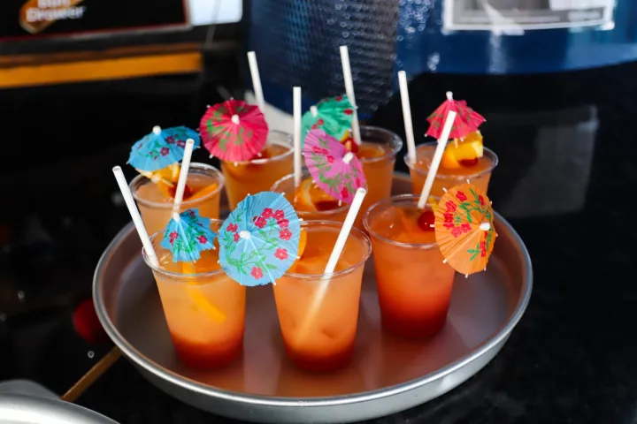 a bowl of orange cocktails on a table