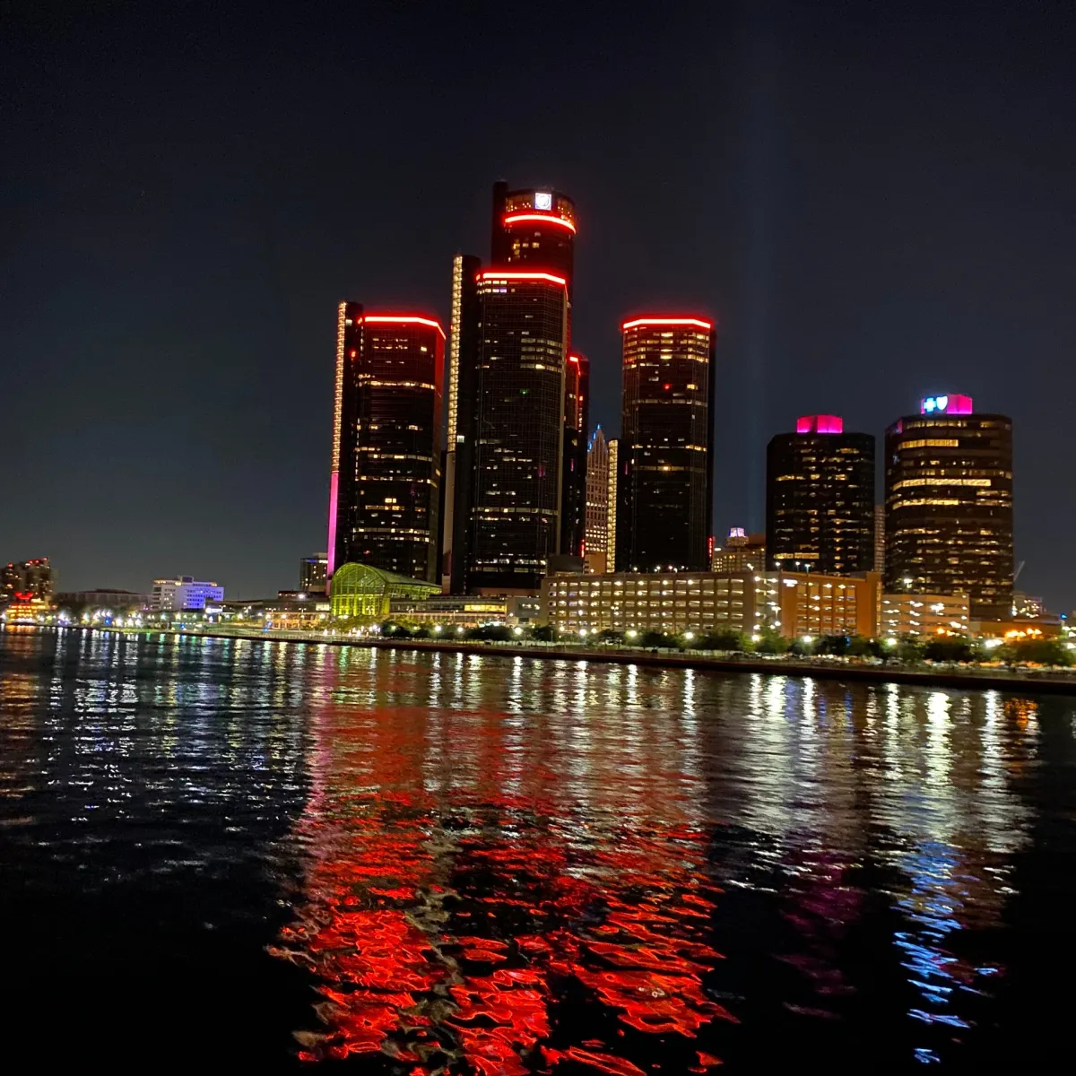 a body of water with a city in the background