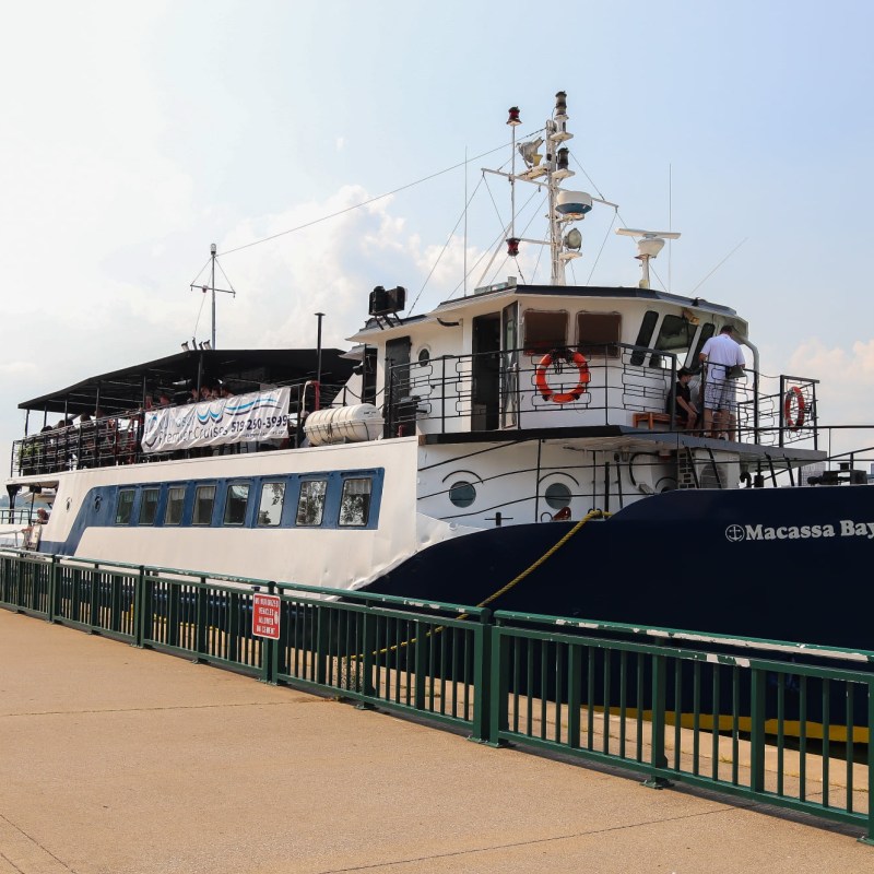 a boat is docked next to a body of water