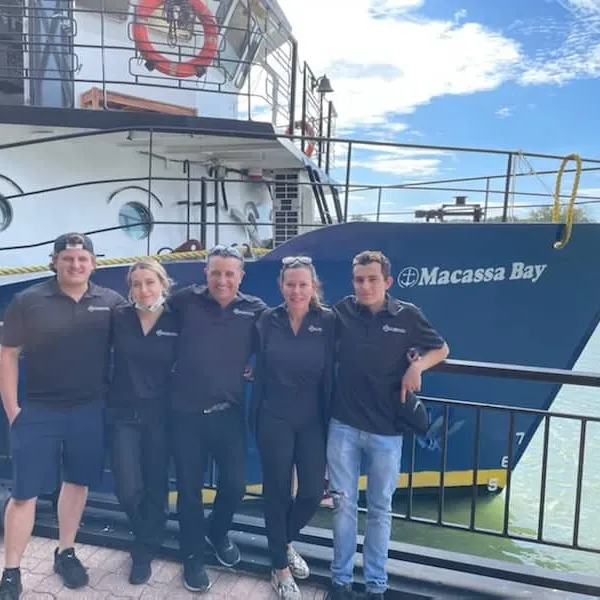 a group of people posing for the camera