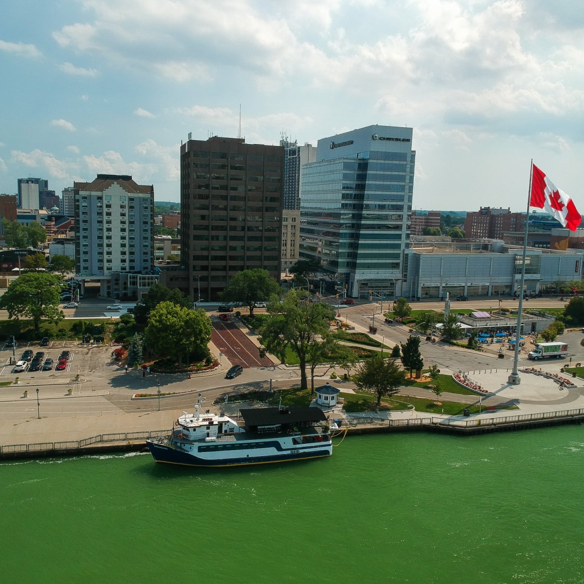 a large body of water with a city in the background