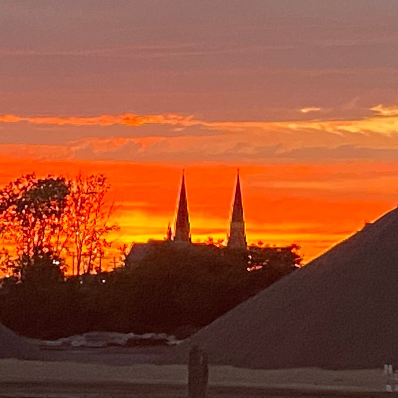 a view of a city at sunset