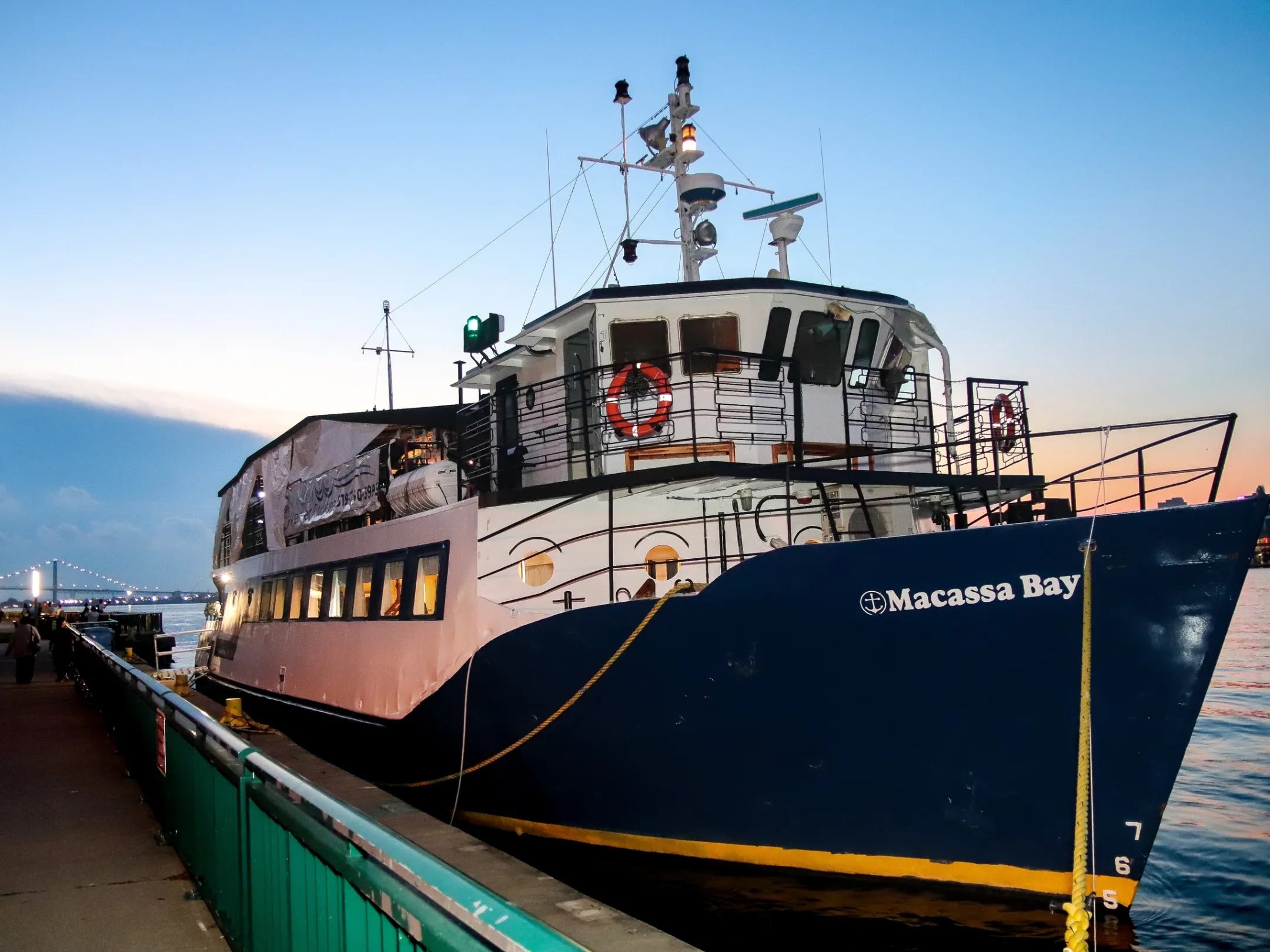 a train sitting on the side of a boat