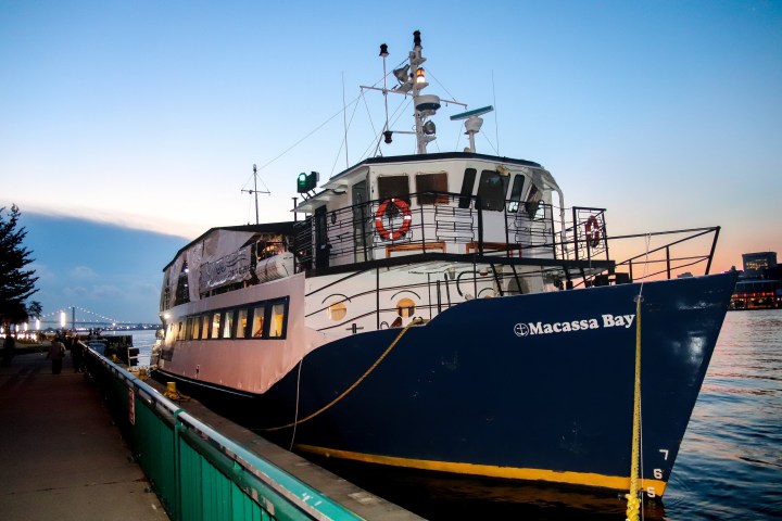 a train sitting on the side of a boat