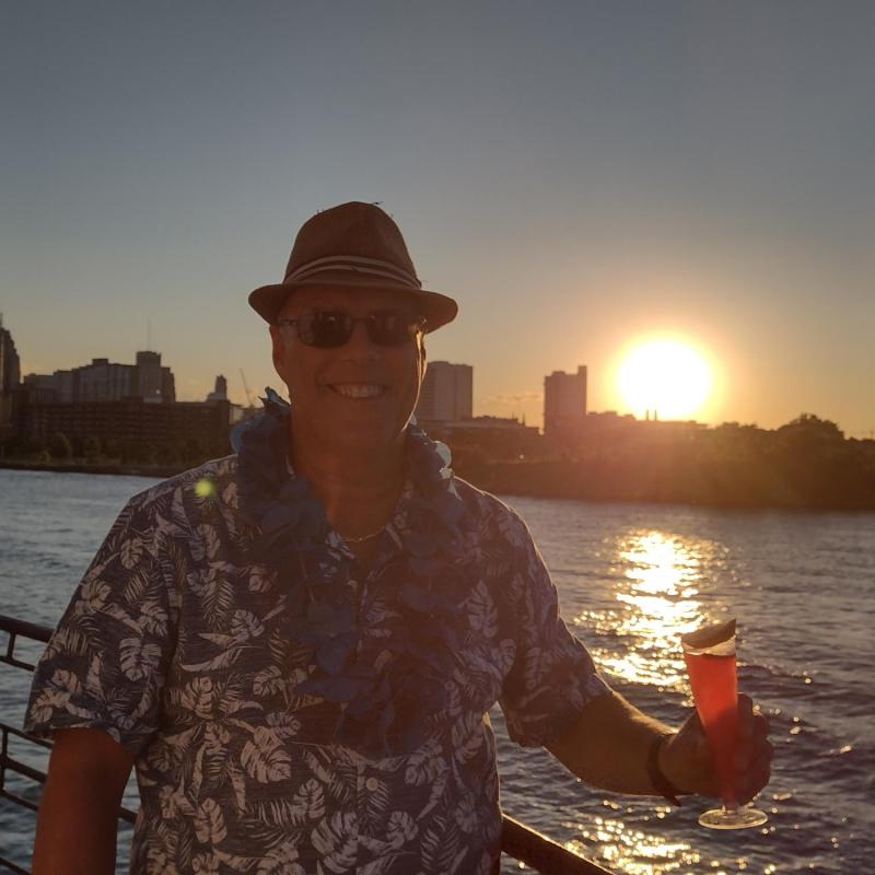 a man standing in front of water