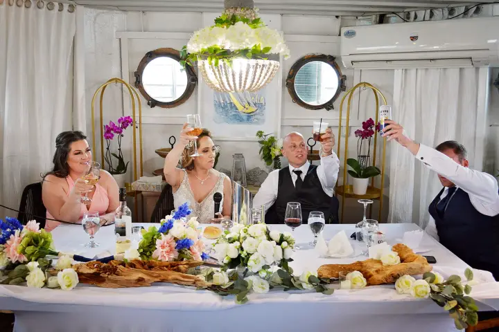 a woman sitting at a table with a plate of food