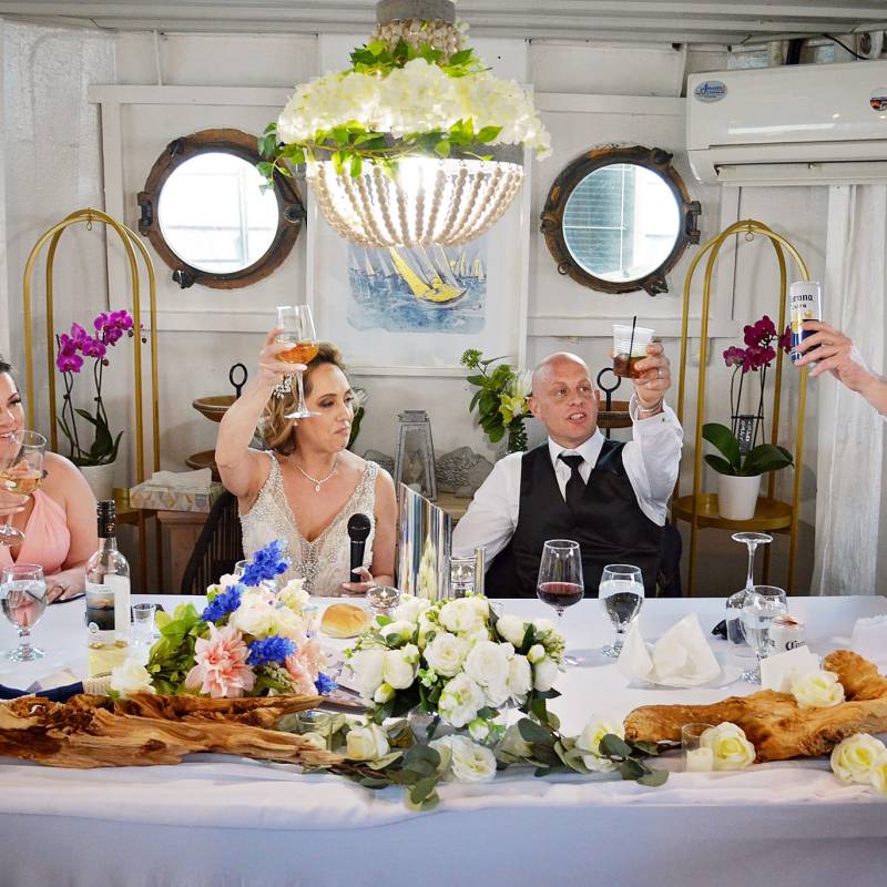 a woman sitting at a table with a plate of food