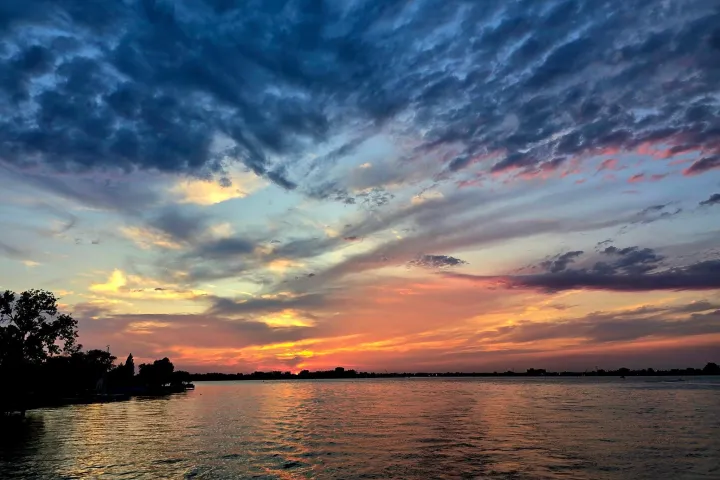 a sunset over a body of water